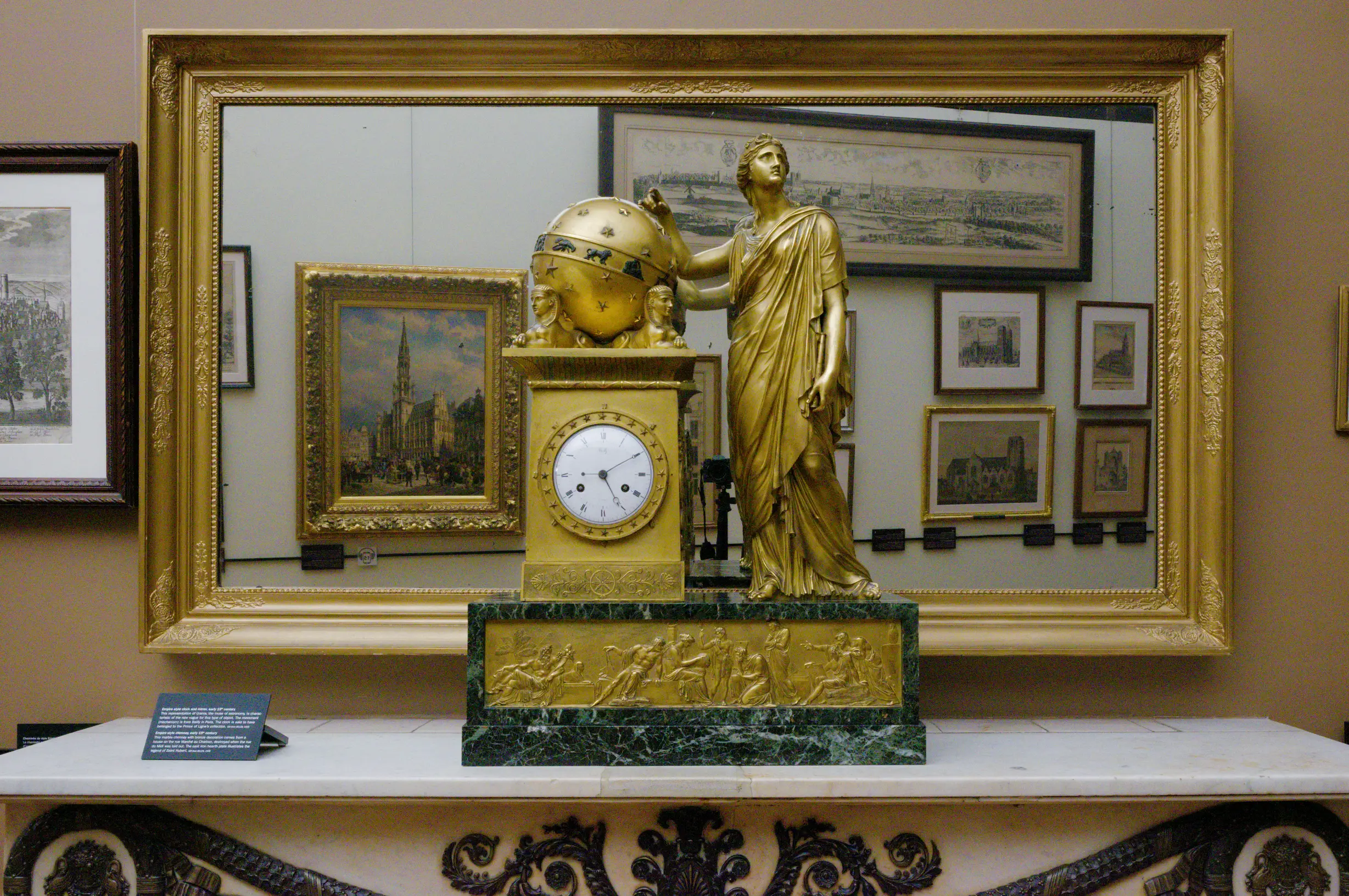 statue of urania on a table