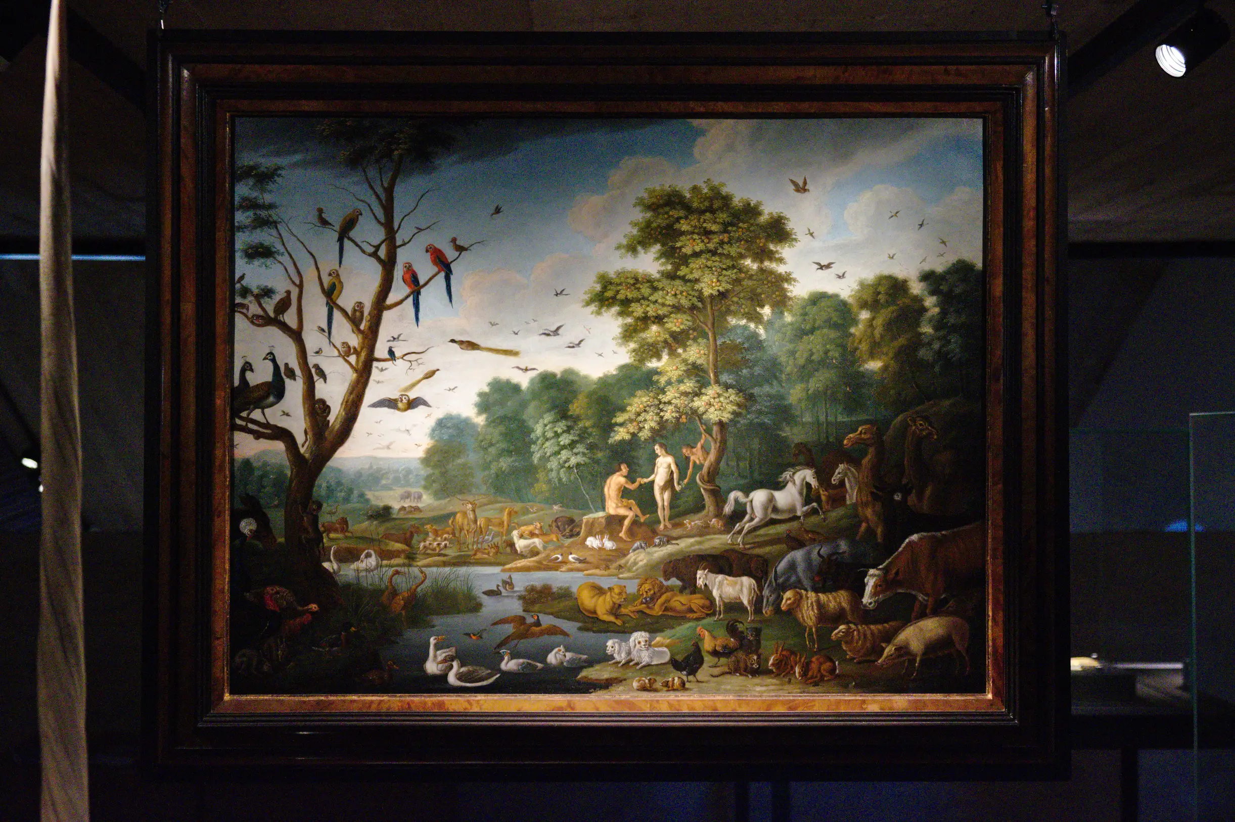 painting of a two nude humans in a forest, surrounded by animals