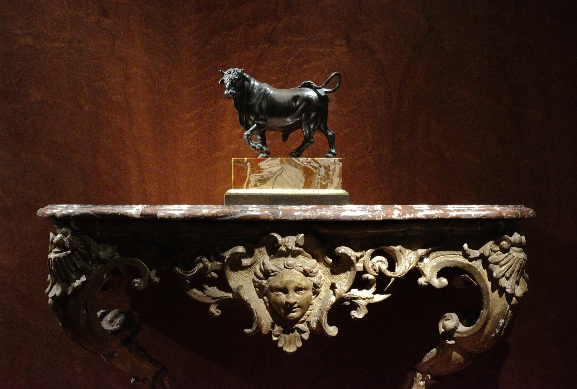 bull statue on ornate table